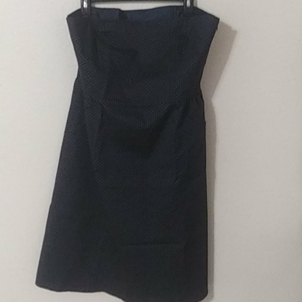 Strapless Dress is lined inside. It is a blue/dk green color w/ gold polkadots